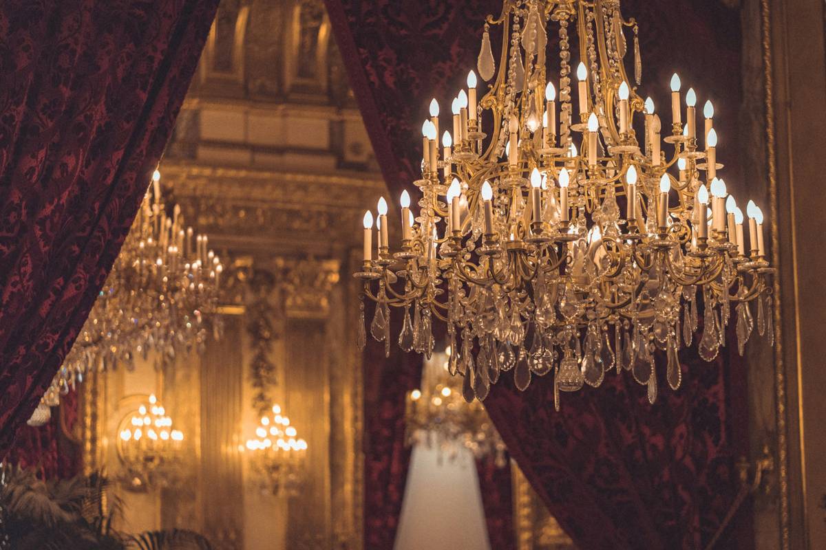 Elegant lighting crystal chandeliers installed in a modern dining room with warm ambient glow